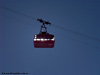 Die Sonne versteckt sich hinter einem Wagen der Trittkopfbahn